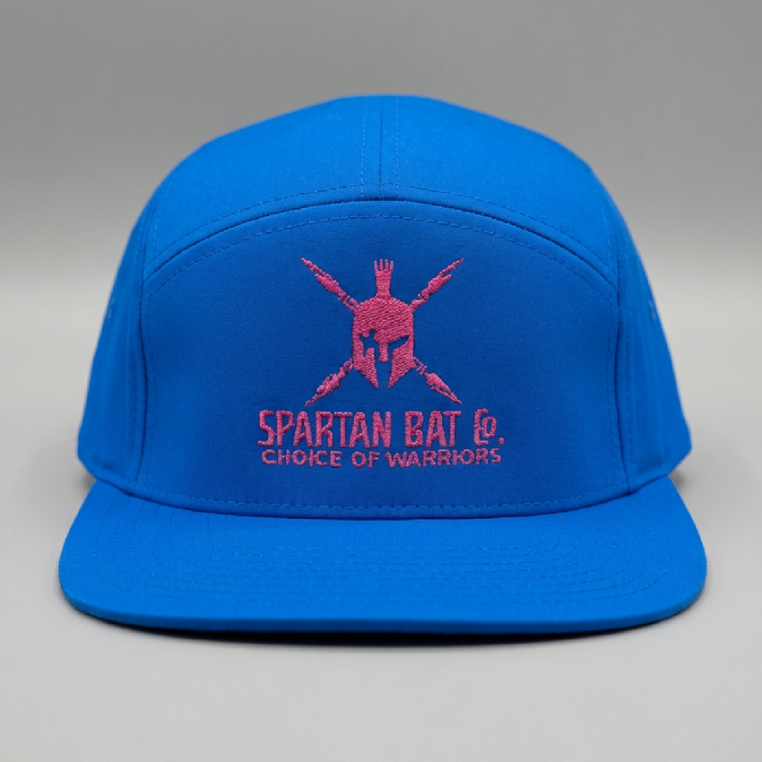 Blue cap with Spartan logo and text on a gray background